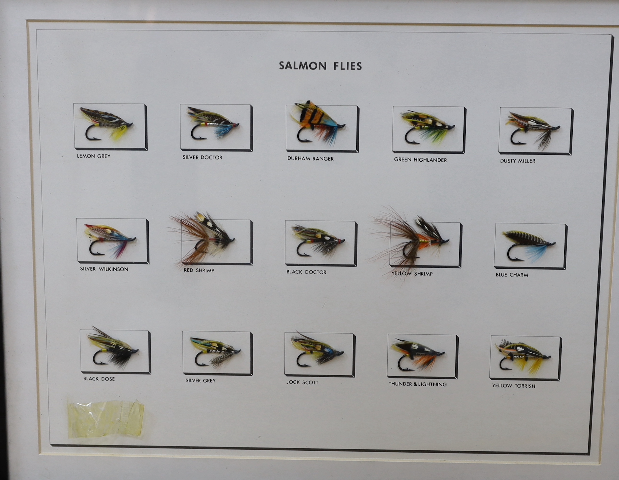 A collection of three framed and glazed fishing flies